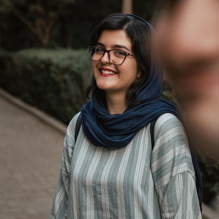 Kaveri Mehta, Lead Design Curator at Grove Harbor Panel, reviewing corporate floral arrangements